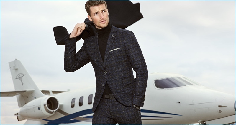 Edward Wilding dons a windowpane print suit for JOOP!'s fall-winter 2017 campaign.