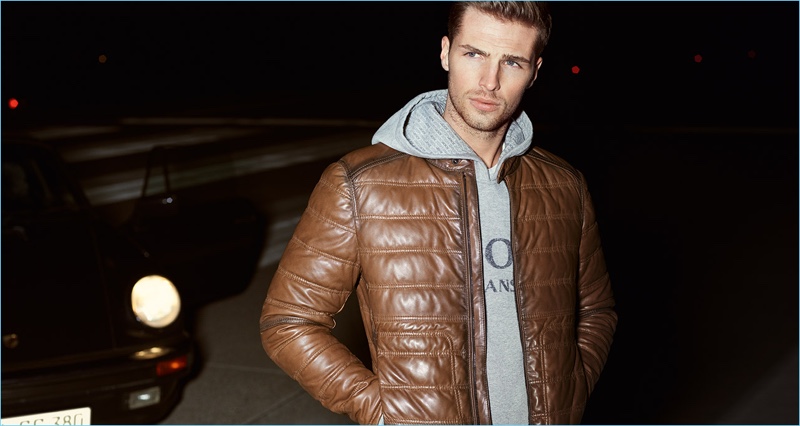Going casual, Edward Wilding wears a quilted brown leather jacket with a hoodie for JOOP!'s fall-winter 2017 campaign.