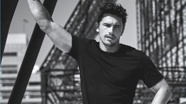 Taking to a roof top, James Franco wears a Giorgio Armani t-shirt with Fabric Brand & Co. denim jeans.