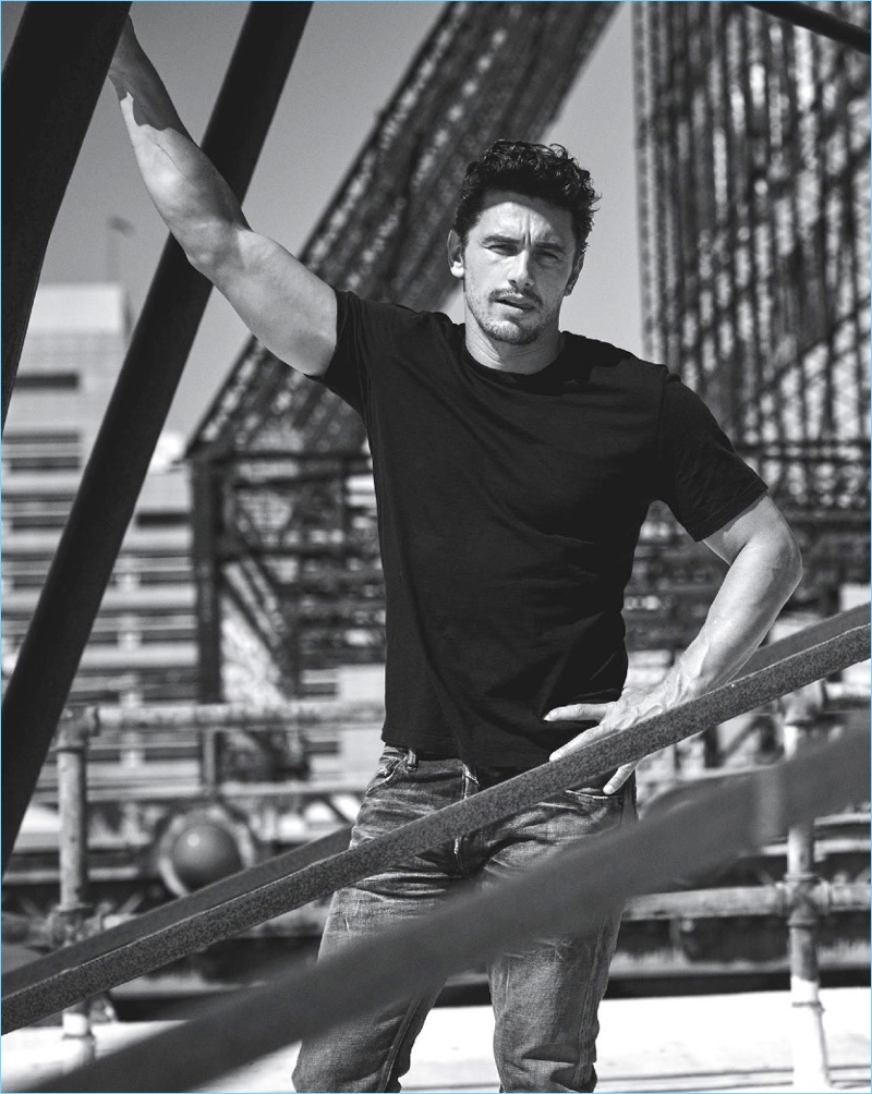 Taking to a roof top, James Franco wears a Giorgio Armani t-shirt with Fabric Brand & Co. denim jeans.