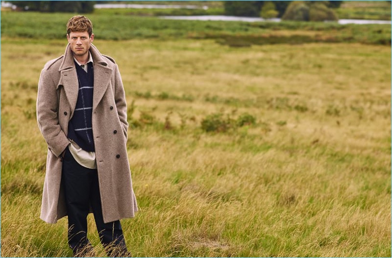 Starring in a Mr Porter shoot, James Norton wears a Marc Jacobs oversize double-breasted coat. He also sports a Dries Van Noten check sweater with a Balenciaga shirt and Margaret Howell trousers.