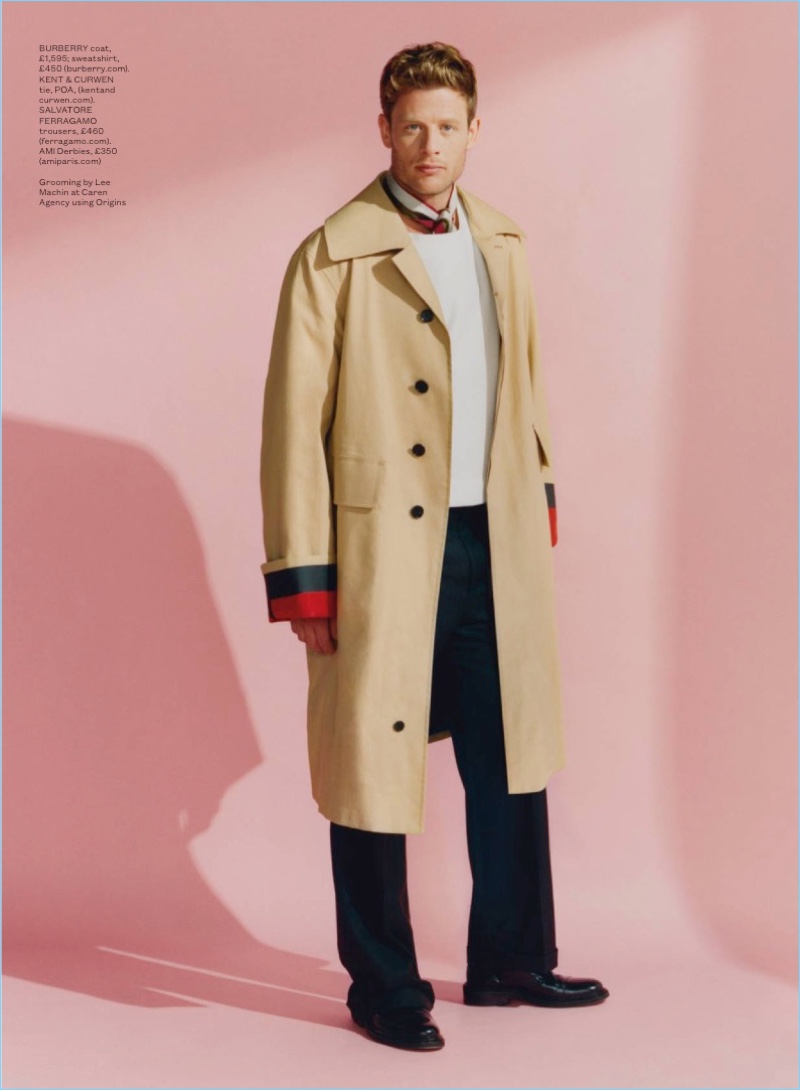 Front and center, James Norton wears a Burberry sweatshirt and coat. The actor also dons a Kent & Curwen tie, Salvatore Ferragamo trousers, and AMI derby shoes.