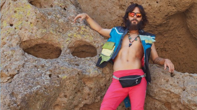 Embracing quirky style, Jared Leto wears a Maison Margiela vest, Christopher Shannon pants, Scarpa shoes, and his own fanny pack.