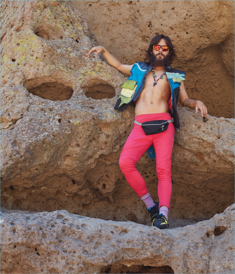 Embracing quirky style, Jared Leto wears a Maison Margiela vest, Christopher Shannon pants, Scarpa shoes, and his own fanny pack.