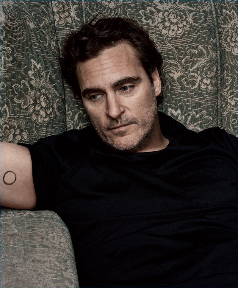 Relaxing, Joaquin Phoenix sports a Ralph Lauren t-shirt.