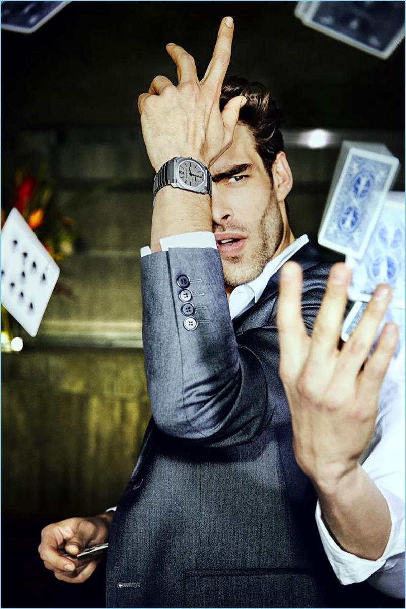 Playing a game of cards Jon Kortajarena wears BVLGARI's Octo Finissimo Automatic timepiece.