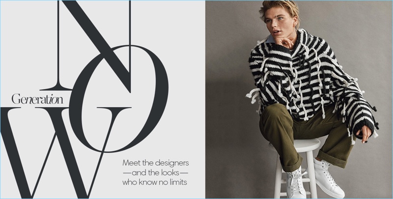 Jordan Barrett wears a striped oversize sweater and trousers by Loewe.