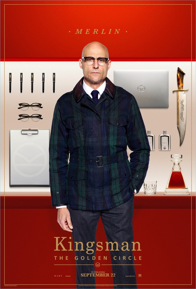 Mark Strong dons a Kingsman + Mackintosh plaid field jacket $830 as Merlin. Strong also sports Kingsman + Cutler and Gross square-frame glasses $380 and wool-flannel trousers $595.