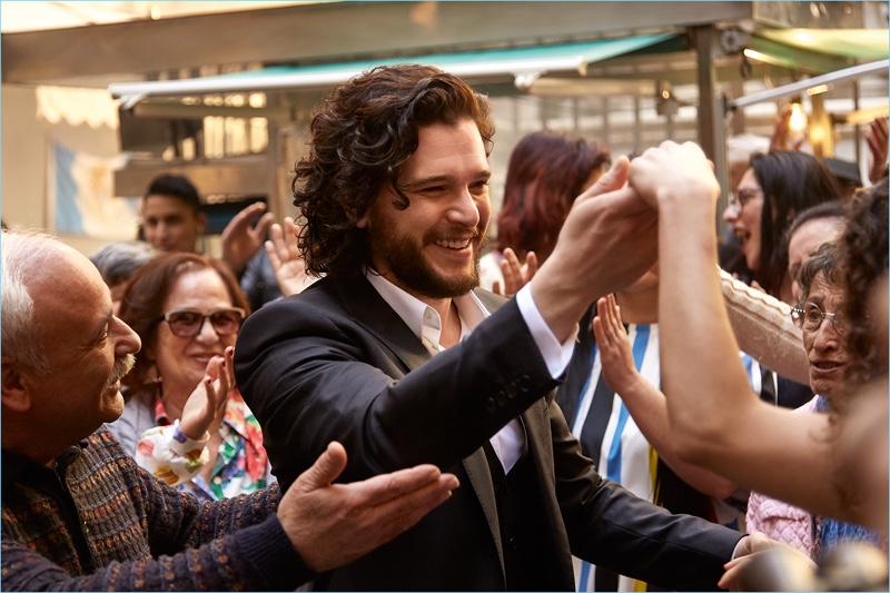 All smiles, Kit Harington films the campaign for Dolce & Gabbana's fragrance, The One.