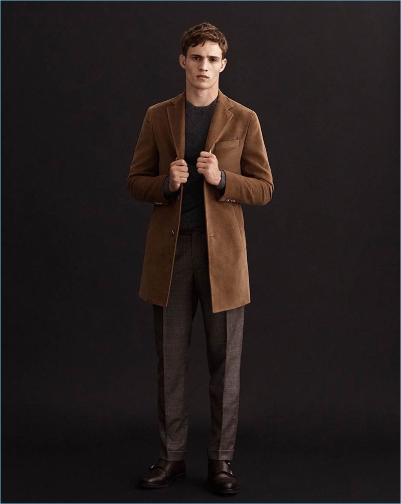 Wearing a sharp brown coat, Julian Schneyder connects with Massimo Dutti for fall.
