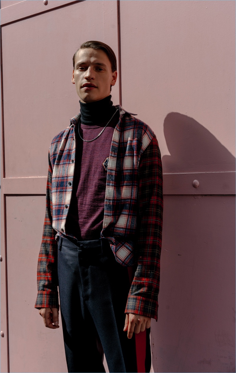 Subscribe to Lanvin's fall style narrative with a contrast-sleeve checked shirt $435. Complete the look with a wool sweater $375 and side-striped trousers $520.