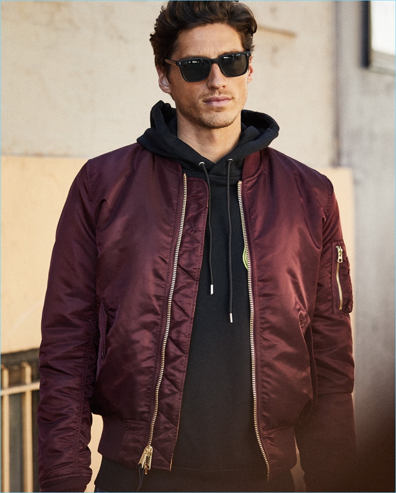 Easy Street: Off-duty style reigns with an Alpha Industries MA-1 bomber jacket $150, McQ Alexander McQueen hoodie $345, and Oliver Peoples sunglasses $405.