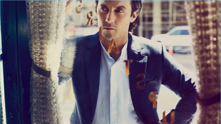 A smart vision, Milo Ventimiglia dons a Tom Ford suit jacket with a Paul Smith grandad collar shirt and Piaget Polo S chronograph watch.