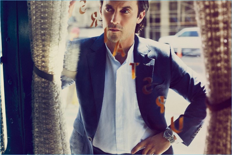 A smart vision, Milo Ventimiglia dons a Tom Ford suit jacket with a Paul Smith grandad collar shirt and Piaget Polo S chronograph watch.