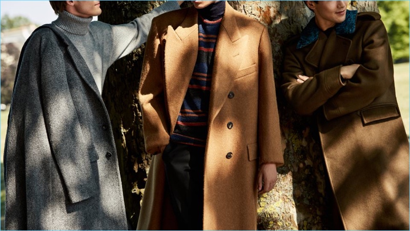 Make a sartorial impression in a tailored coat. Left to Right: Massimo Alba herringbone wool coat and Tomas Maier cashmere sweater. Dries Van Noten double-breasted coat, Lanvin striped sweater, and Canali trousers. Berluti double-breasted cashmere coat.