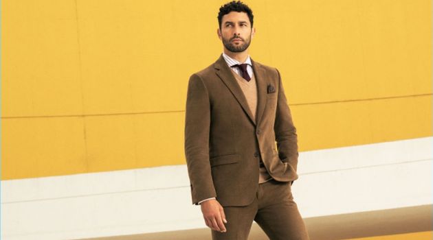 Business Class: Noah Mills Fronts Pedro del Hierro Fall '17 Campaign Posing against a yellow backdrop, Noah Mills stars in Pedro del Hierro's fall-winter 2017 campaign.
