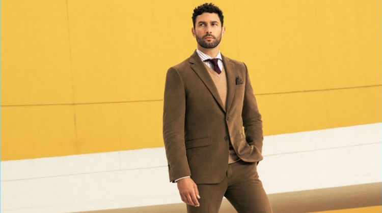 Posing against a yellow backdrop, Noah Mills stars in Pedro del Hierro's fall-winter 2017 campaign.