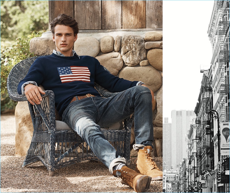 Simon Nessman relaxes in POLO Ralph Lauren's iconic flag sweater $225. He also wears the label's Sullivan slim stretch jeans $198.