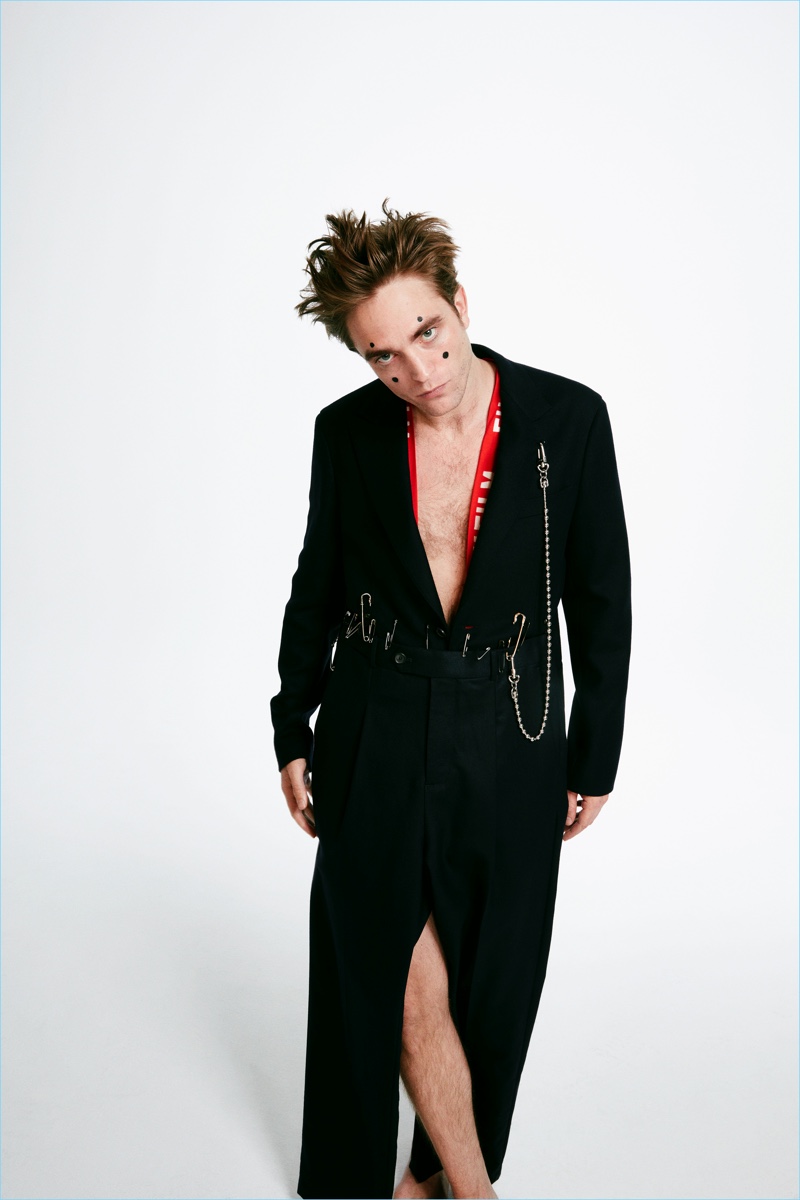 Embracing quite the look, Robert Pattinson appears in a Wonderland photo shoot.