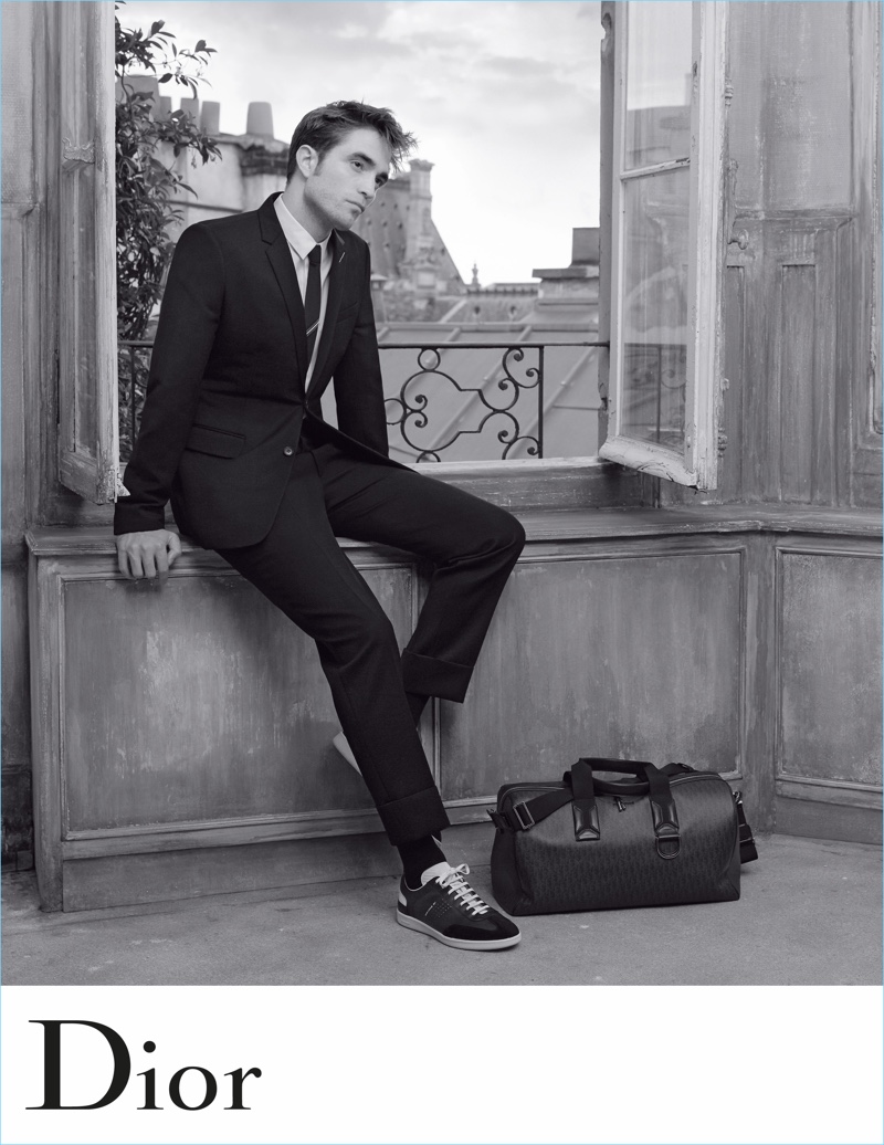 Robert Pattinson dons a tailored suit and sneakers for Dior Homme's spring-summer 2018 campaign.