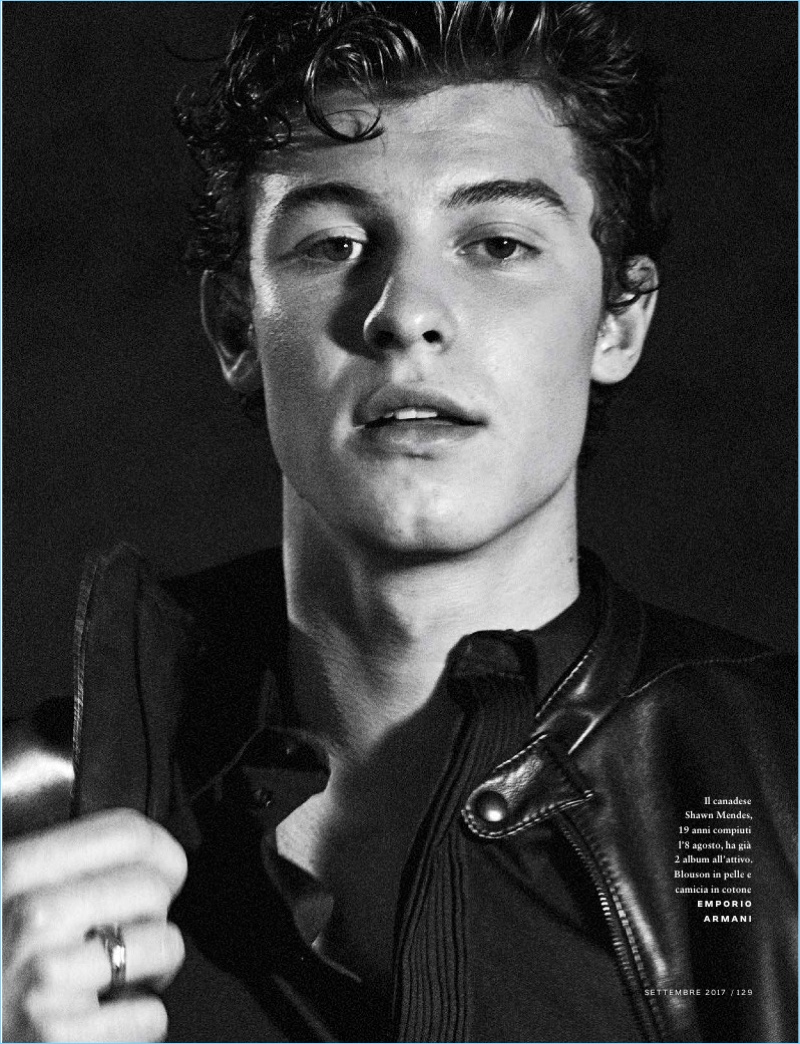 Singer Shawn Mendes wears a shirt and leather jacket by Emporio Armani.