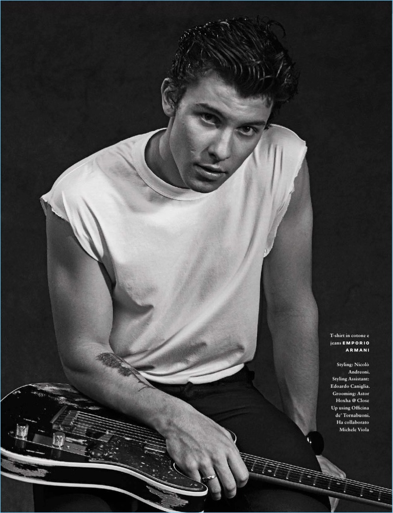 Channeling 50s greaser style, Shawn Mendes wears a t-shirt and trousers by Emporio Armani.