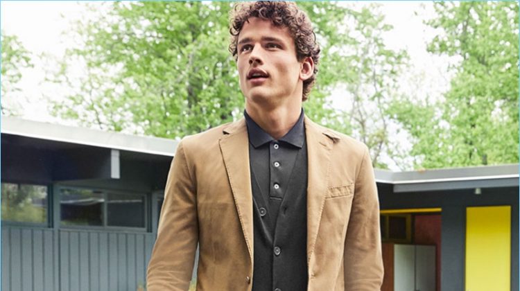 Macy's makes a case for smart fall layers. Simon Nessman wears a POLO Ralph Lauren sport coat $295 and v-neck cardigan $98.50. He also sports a POLO polo $98.50 and chino pants $89.50.