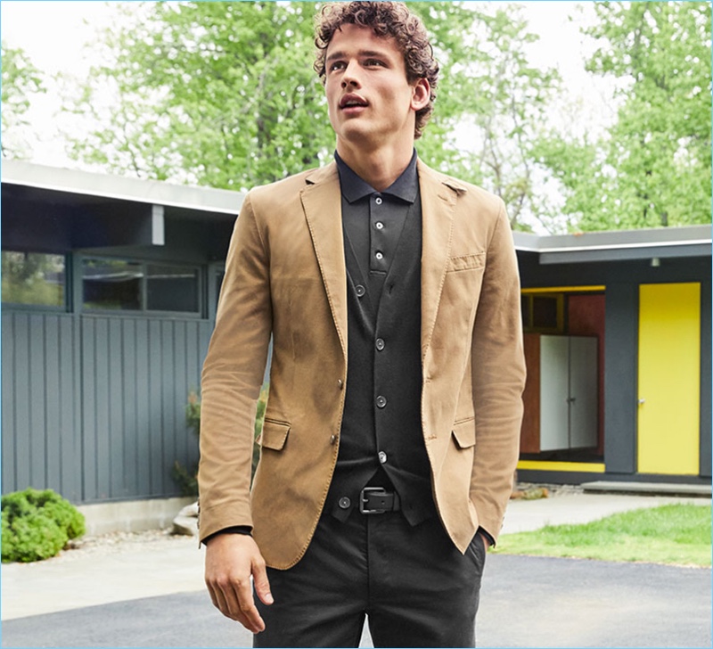 Macy's makes a case for smart fall layers. Simon Nessman wears a POLO Ralph Lauren sport coat $295 and v-neck cardigan $98.50. He also sports a POLO polo $98.50 and chino pants $89.50.