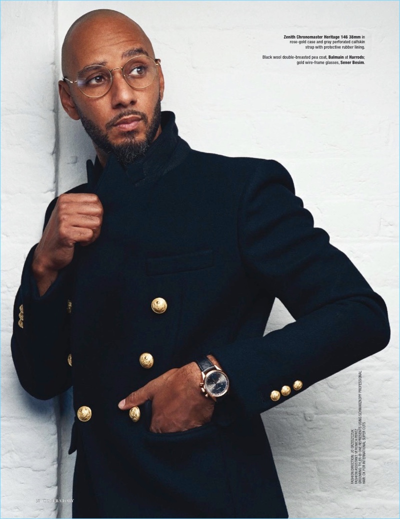 A sharp vision, Swizz Beatz wears a Balmain peacoat with Sener Besim sunglasses and a Zenith watch.