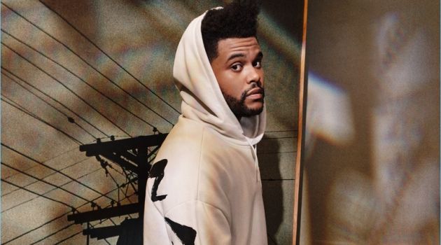 Reuniting with H&M, The Weeknd wears a white oversize hoodie $34.99.