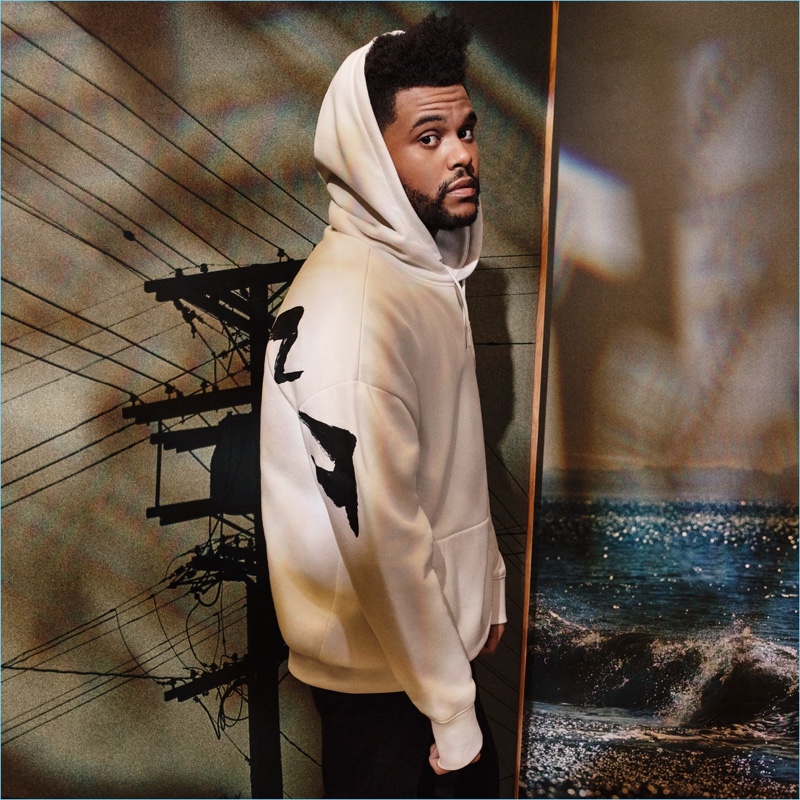 Reuniting with H&M, The Weeknd wears a white oversize hoodie $34.99.