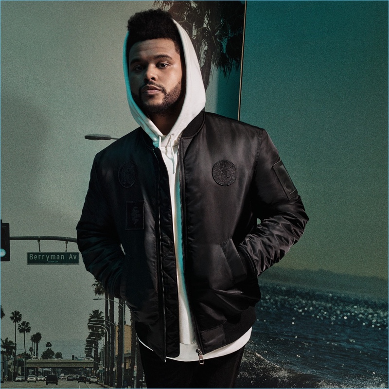 Making a case for sporty style, The Weeknd wears a bomber jacket $79.99 and oversize hoodie $34.99.