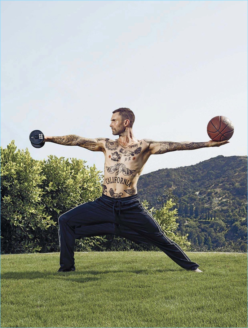 Working out, a shirtless Adam Levine appears in a photo shoot for Men's Fitness.