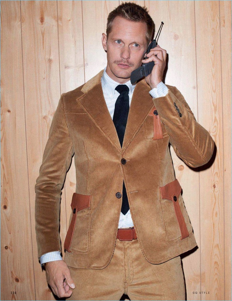 Taking a phone call, Alexander Skarsgård wears a corduroy look by Prada.