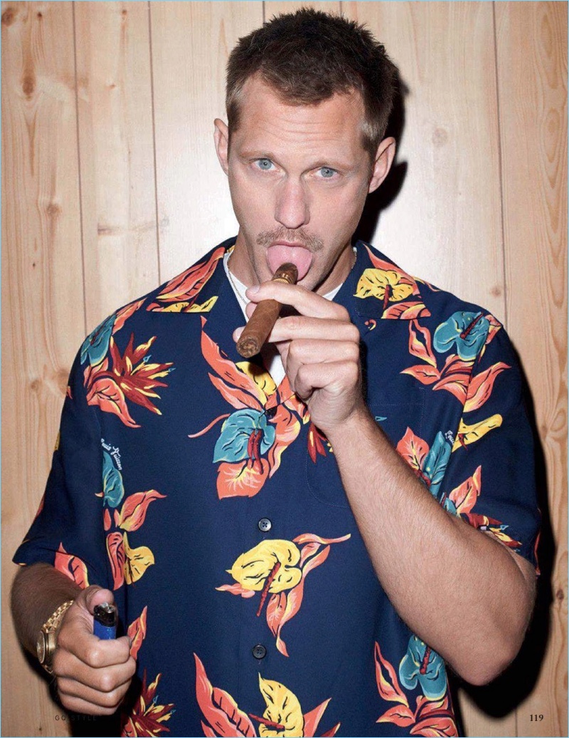 Actor Alexander Skarsgård wears a Louis Vuitton Hawaiian print shirt. He also sports a Sunspel t-shirt and Tom Ford sunglasses.