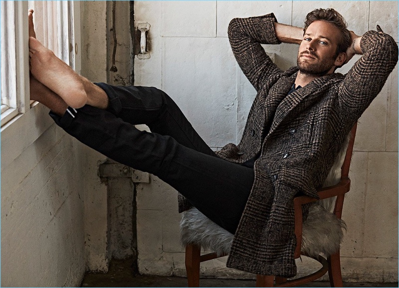 Actor Armie Hammer wears a Brunello Cucinelli coat with a John Varvatos henley and Tom Ford jeans.