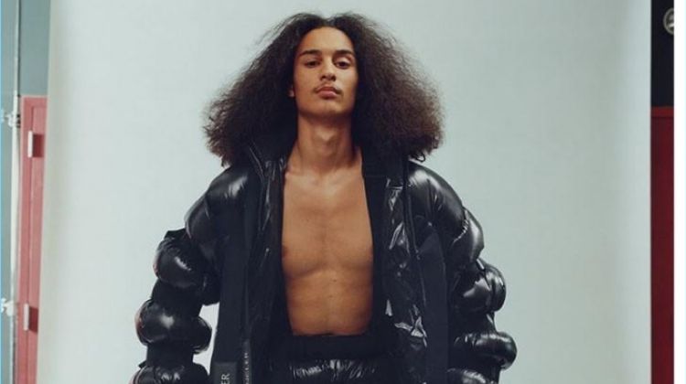 Taj Figueroa wears a puffer jacket and pants by Moncler.