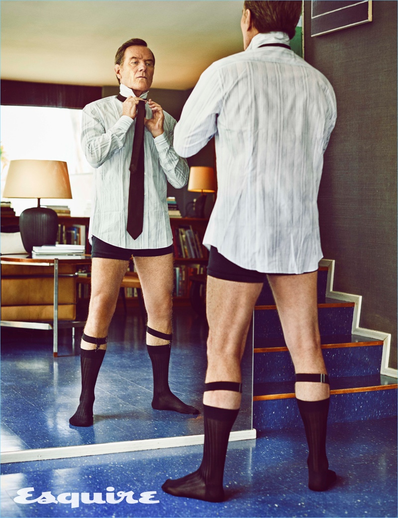 Getting dressed, Bryan Cranston wears a shirt and tie by Salvatore Ferragamo with Pantherella socks.