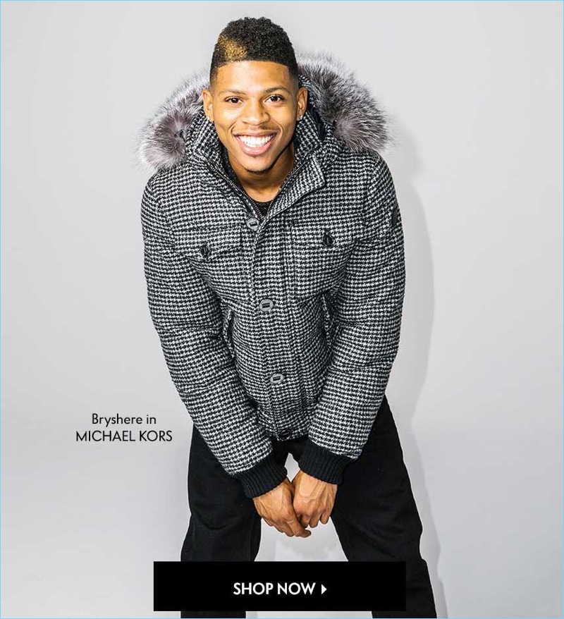 Wearing Michael Kors, Bryshere "Yazz" Gray sports a houndstooth parka $798 with selvedge denim jeans $148.