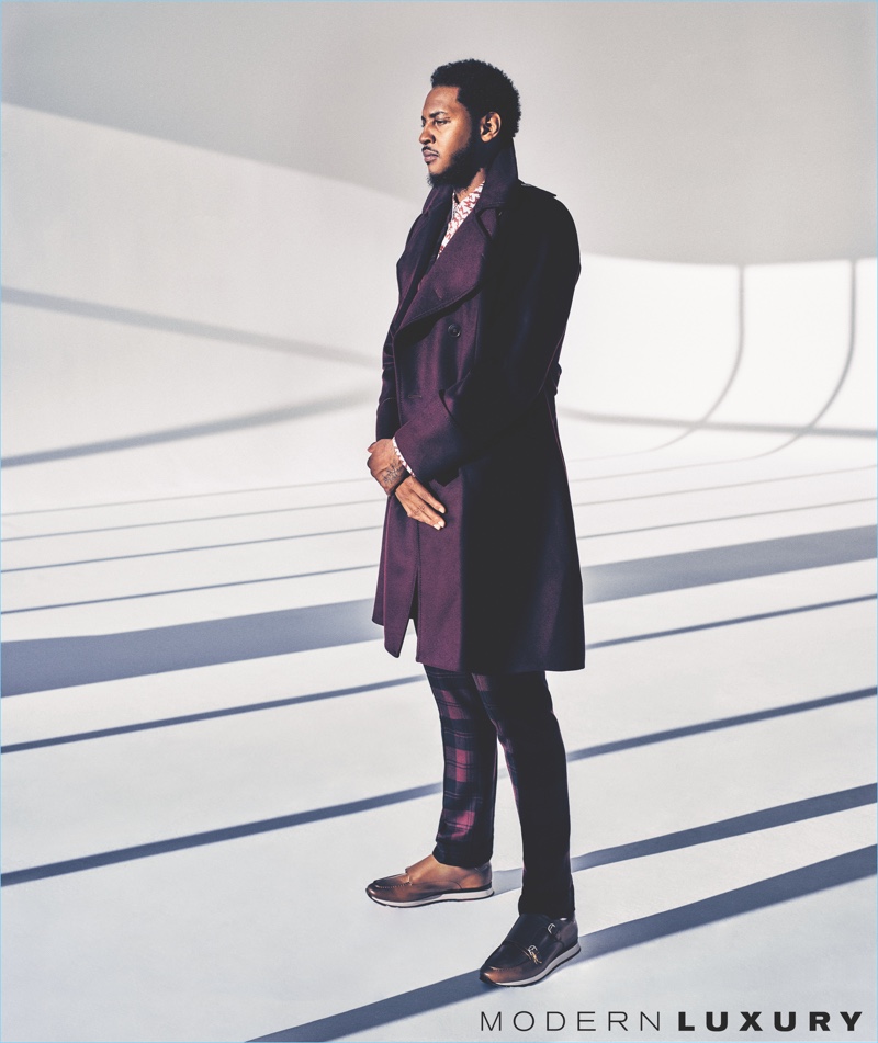 Sporting purple, Carmelo Anthony wears a Bottega Veneta coat with a Marni shirt. He also wears check Valentino trousers and Bally shoes.