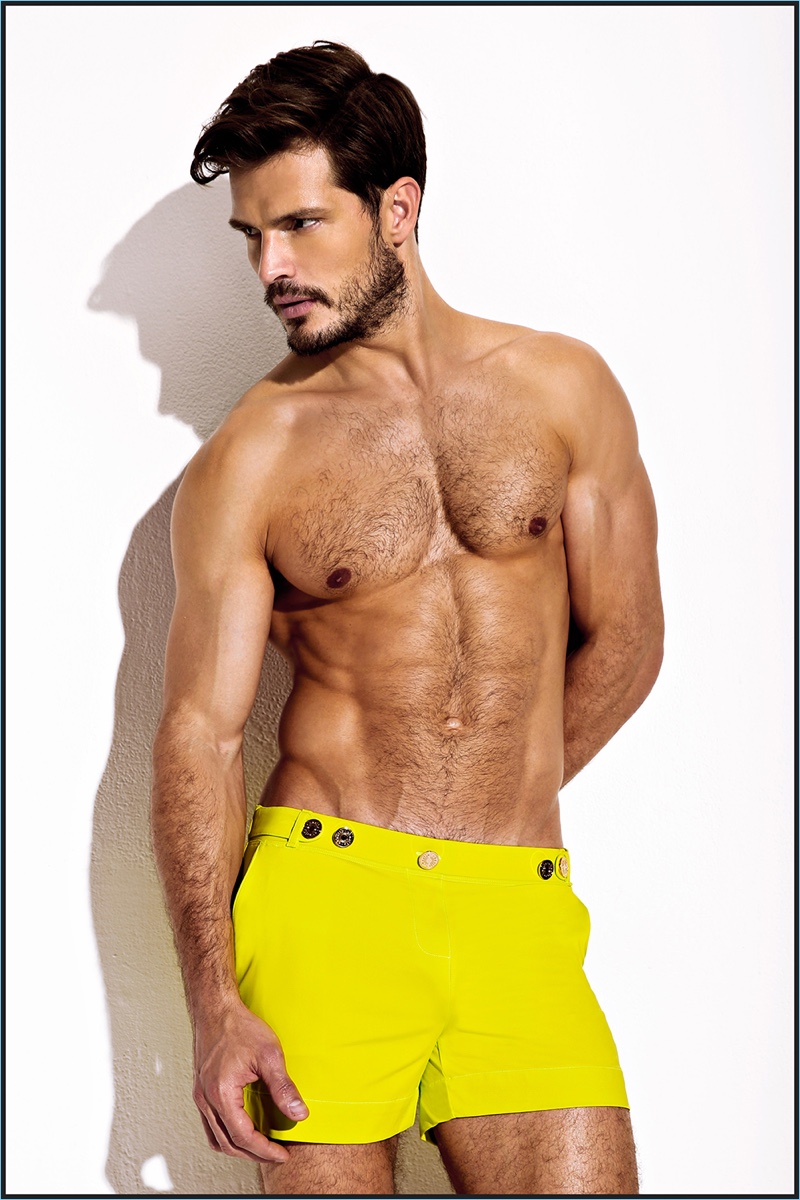 Making a colorful splash, Diego Miguel wears fluorescent resort shorts from Charlie by Matthew Zink.