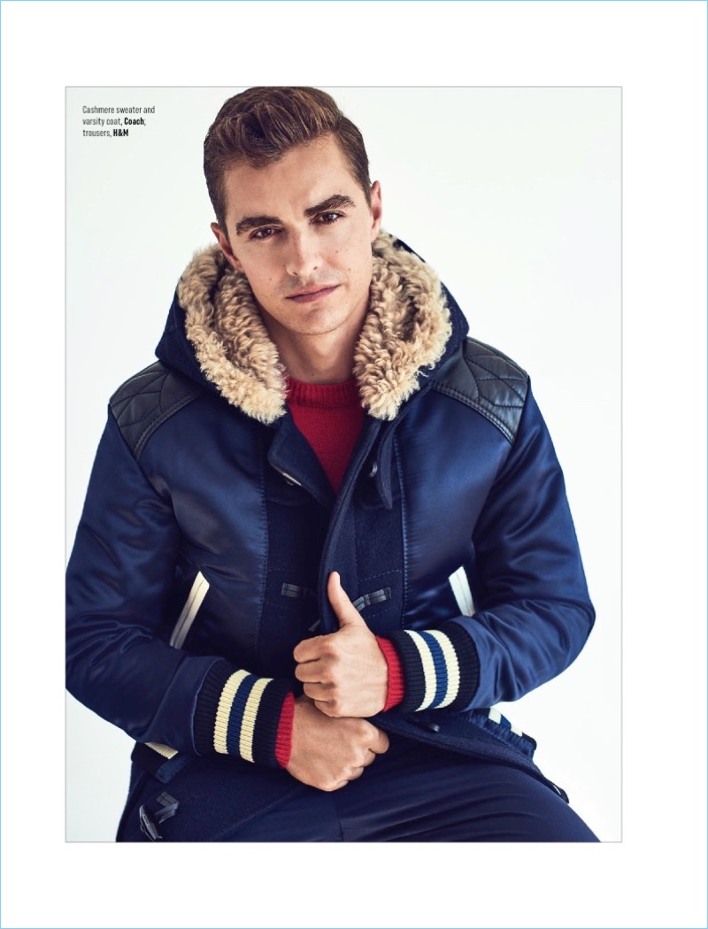Starring in an August Man photo shoot, Dave Franco wears a Coach sweater and varsity jacket with H&M pants.