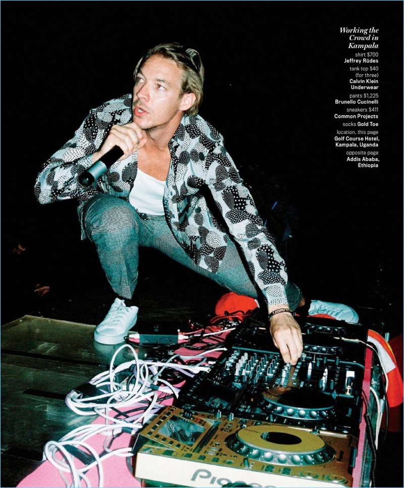 Performing, Diplo wears a Jeffrey Rüdes shirt with a Calvin Klein tank, Brunello Cucinelli trousers, and Common Projects sneakers.