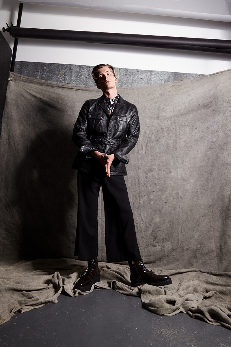 Pavel wears leather jacket Saint Laurent, shirt, trousers, and shoes McQ Alexander McQueen.