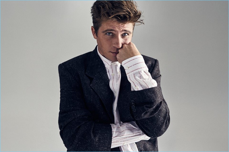 Actor Garrett Hedlund wears a Balenciaga tweed blazer and oversize button-down shirt.