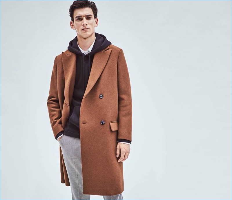 Ready for the cold weather, Thibaud Charon wears a brown H&M wool-blend coat $129.