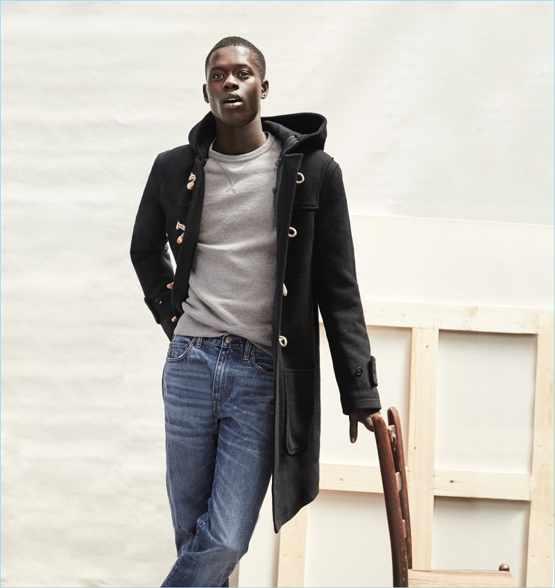 J.Crew makes a case for its classic dufflecoat. Here, model Alpha Dia wears it with the brand's 1040 athletic jeans.