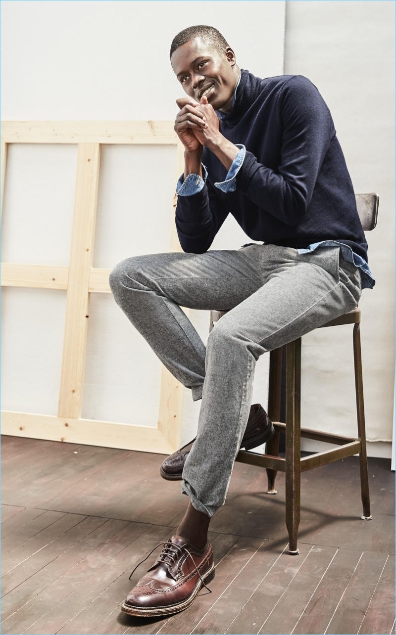Alpha Dia wears J.Crew 770 straight-fit brushed twill pants with a denim work shirt. He layers with an Italian merino wool turtleneck. Alden bluchers complete his look.