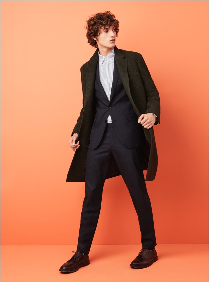J.Crew makes a case for its Ludlow topcoat. Here, model Serge Rigvava wears it with a Ludlow suit jacket and pants. He also sports a Thomas Mason for J.Crew oxford shirt.