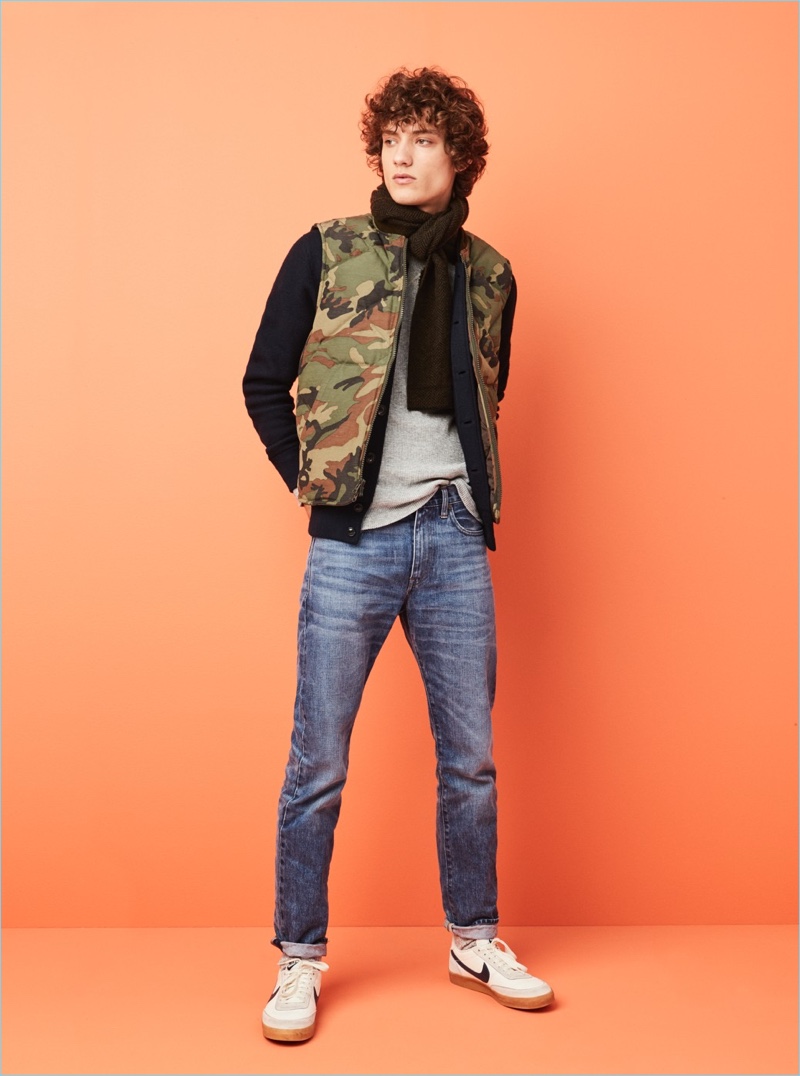 Embrace a rugged sporty aesthetic with J.Crew's Nordic camouflage down vest. Model Serge Rigvava wears it with a Wallace & Barnes bomber jacket and thermal tee. He also sports J.Crew's 1040 athletic jeans, a herringbone scarf, and Nike for J.Crew sneakers.